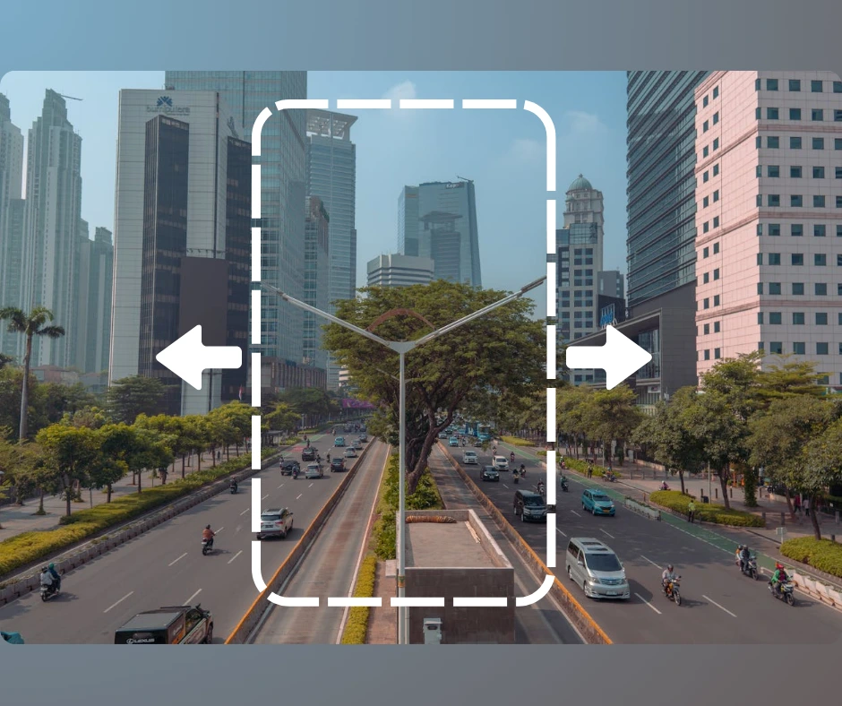 Un'immagine di una città con grattacieli e veicoli in movimento, al centro un rettangolo con bordi tratteggiati